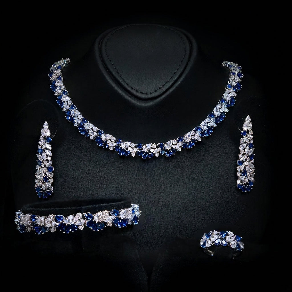 Omnia Safira rhodium-plated bridal jewellery set with blue and clear zircon stones, including necklace, earrings, bracelet and ring