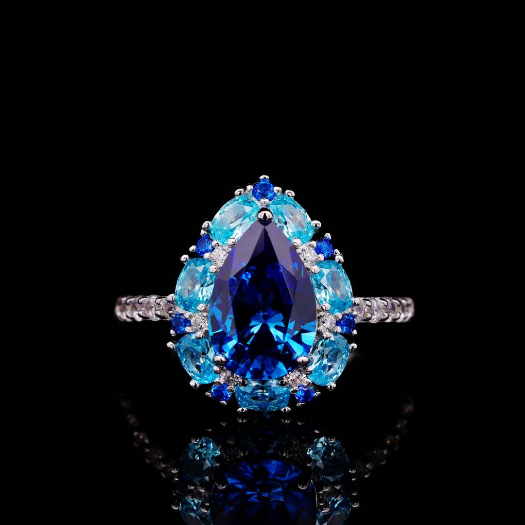 Omnia Sireesha Blue Pear-Cut Ring with High-Quality Simulated Diamonds in Premium Rhodium Plated 925 Sterling Silver