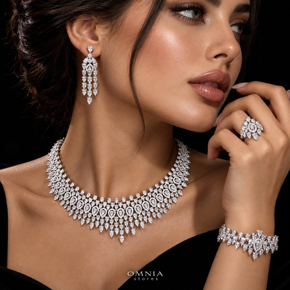 Model wearing the Omnia Alexa white zircon bridal jewellery set with necklace, earrings, bracelet and ring