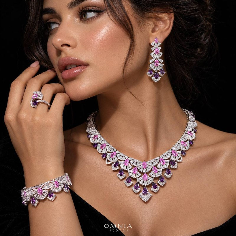 Model wearing the Omnia Lena pink zircon bridal jewellery set with necklace, earrings, bracelet and ring